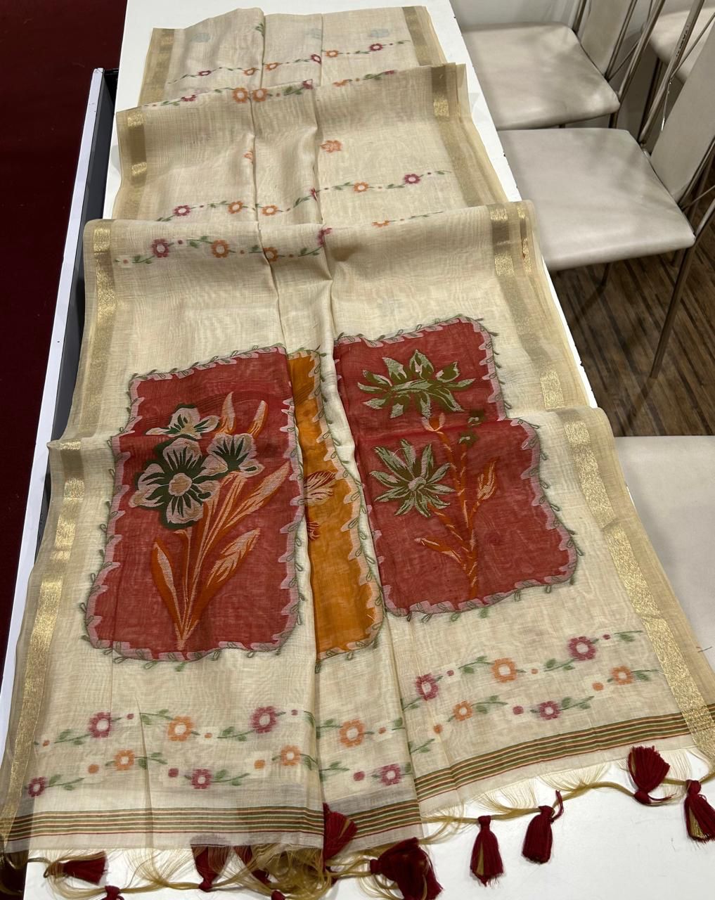 Premium muga cotton saree with multi colour flower weaving pallu