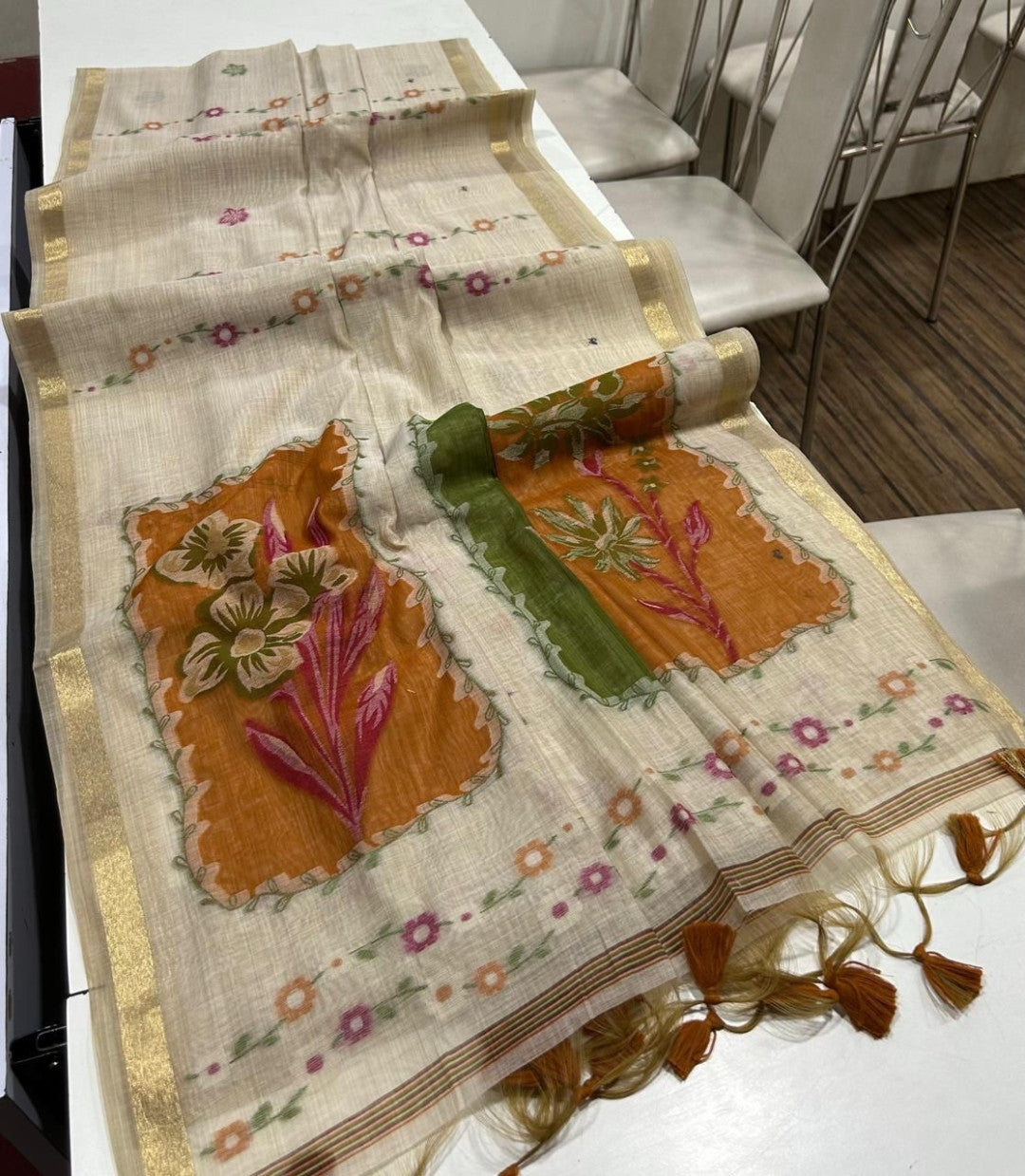 Premium muga cotton saree with multi colour flower weaving pallu